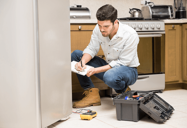 Professional plumbing repair under kitchen sink